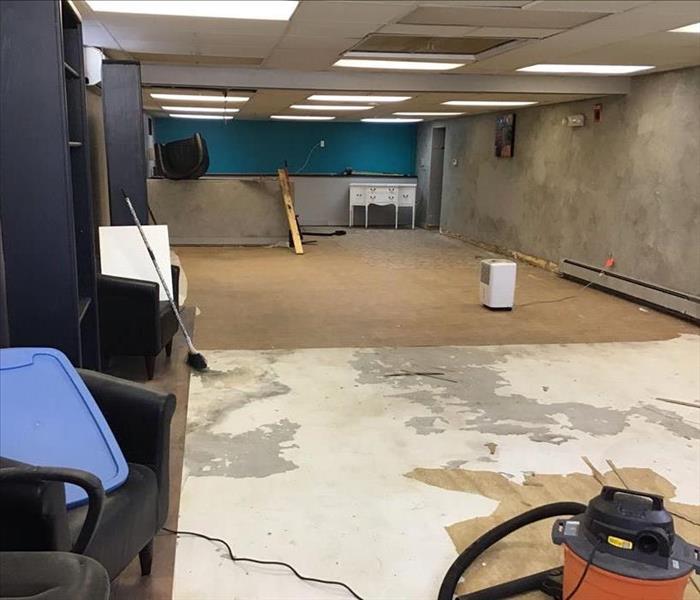 Water damaged commercial building with wet drywall throughout the entire basement